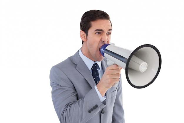 Businessman shouting into a megaphone