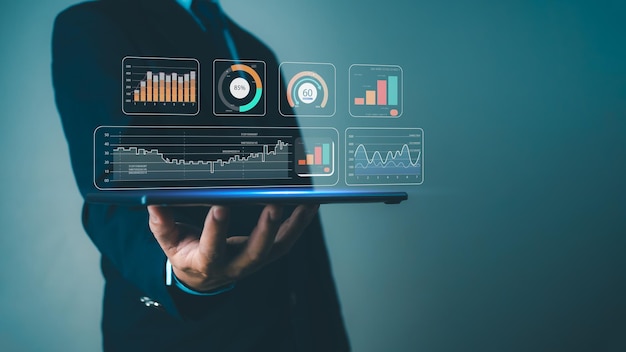 businessman show tablet to analyze business and manage corporate data