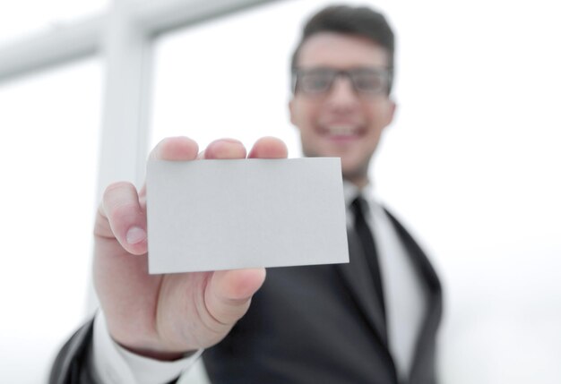 Businessman showing a blank business card