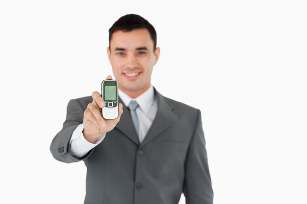 Businessman showing cellphone