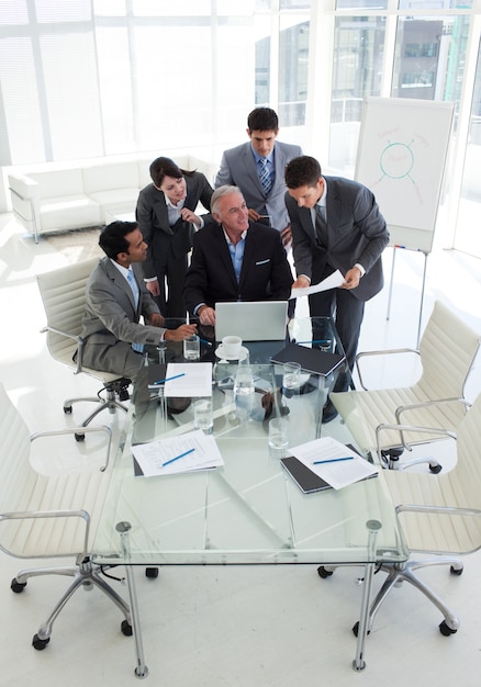 Businessman showing document to his senior manager