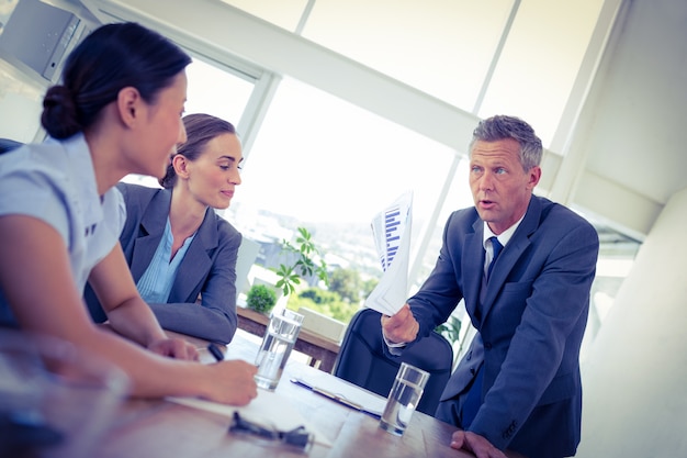 Businessman showing documents during meeting