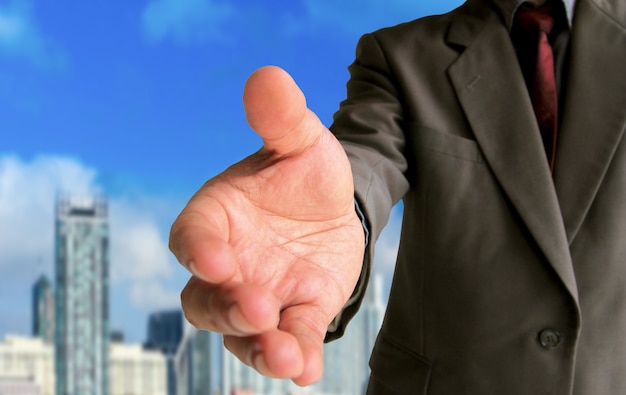 Businessman showing gesture handshake