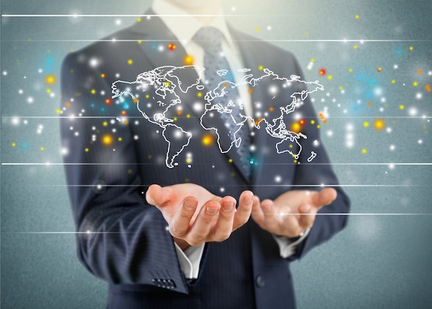 Businessman showing glowing digital world map on background