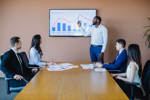 Businessman showing graph on board