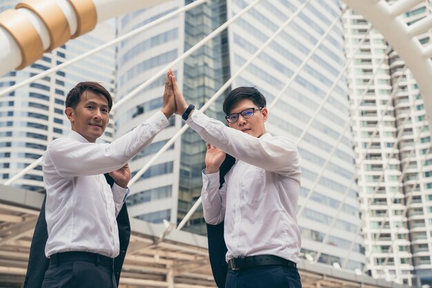 Businessman showing unity with their hands together