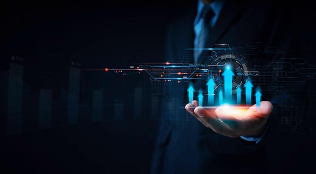 Businessman showing a virtual graph on his hand the direction of the graph is upward indicating bus