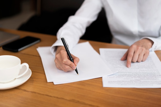 Businessman signing a contract at the office