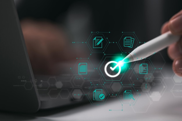businessman signing edocument with stylus pen on digital tablet to assure quality
