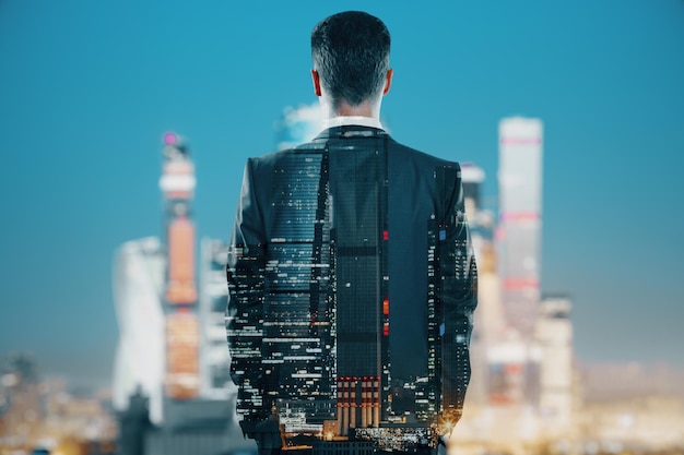 Businessman silhouette on city background