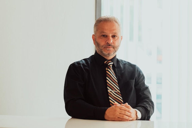 A businessman sits in his and works with paperworkHigh quality photo