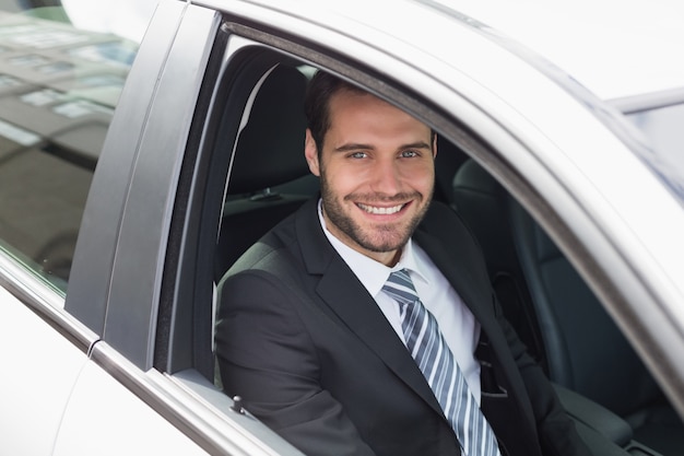 Businessman sitting in drivers seat