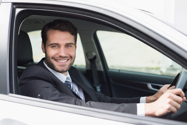 Businessman sitting in drivers seat