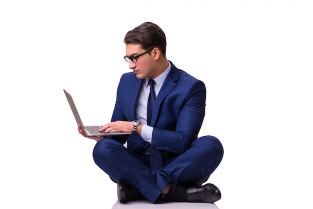 Businessman sitting on the floor isolated