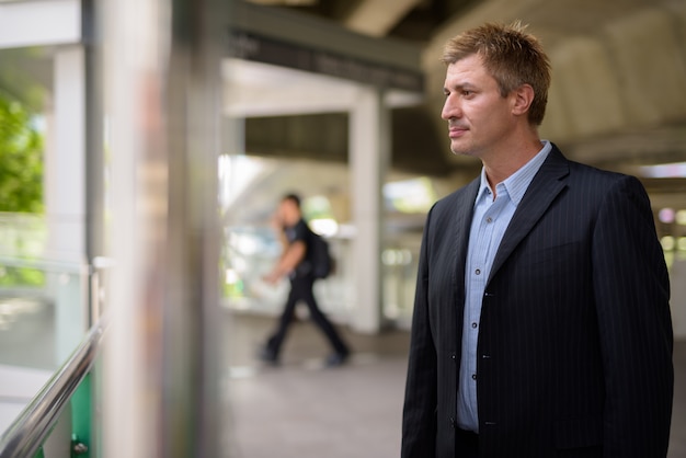 Businessman at the sky train station