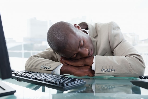 Businessman sleeping on his desk