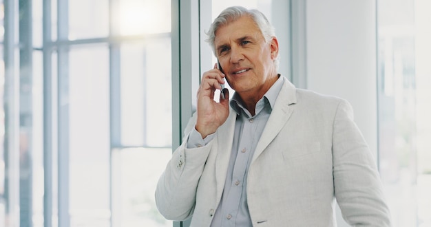 Businessman smile and phone call in office for communication and conversations Happy man having a successful business discussion call on a mobile smartphone in office