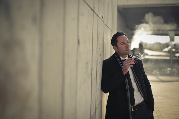 Businessman smoking outdoor