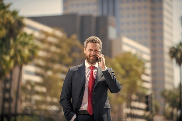 Businessman speak on smartphone man boss has conversation business negotiation