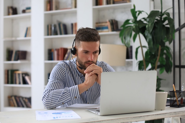 Businessman speak talk on video call with colleagues on online briefing during self isolation and quarantine. flu epidemic and covid-19