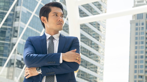 Businessman stand with feeling confident and freedom at outdoor