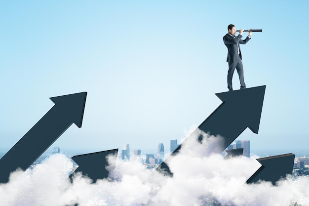 businessman standing on abstract arrow and using telescope