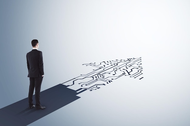 Businessman standing on abstract circuit arrow sketch on white background with mock up place Success and digital transformation concept