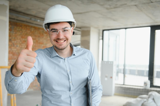 Businessman standing in building in construction process