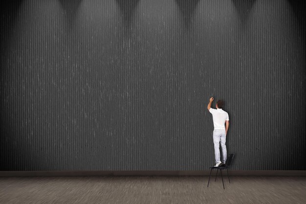 Businessman standing on chair