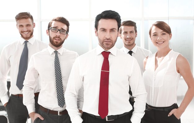 Businessman standing in front of his business team the concept of teamwork