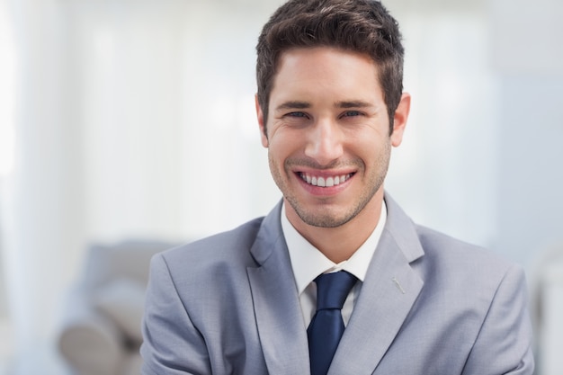 Businessman standing in the living room