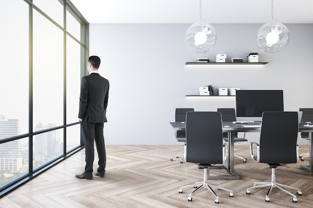 Businessman standing in office interior