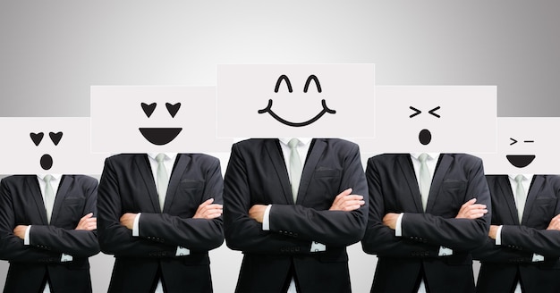 Businessman standing white paper happy smile face holding front of head