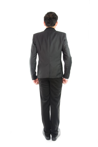 Businessman standing with back isolate