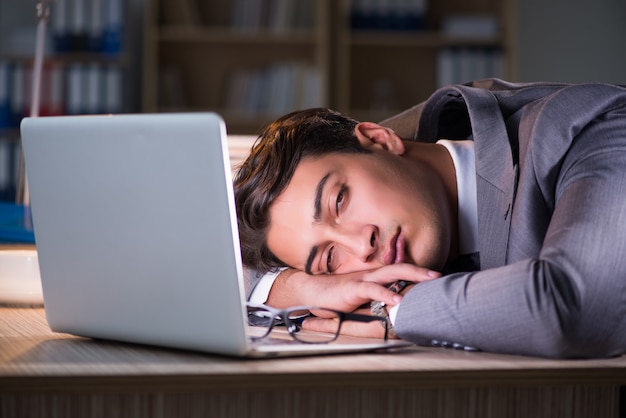 Businessman staying in the office for long hours