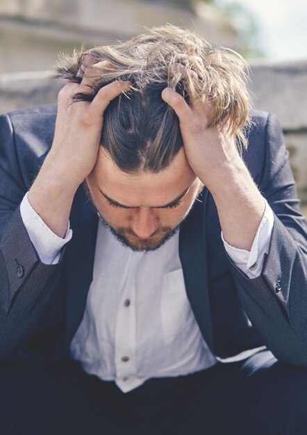 A businessman stressed from work