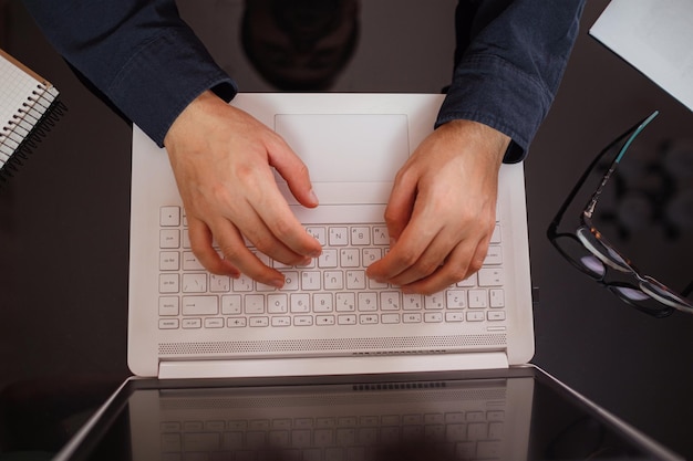 Businessman or student using laptop at home