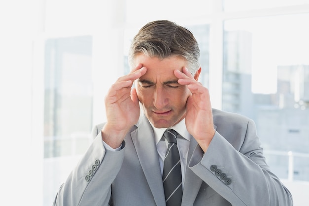 Businessman suffering from a headache