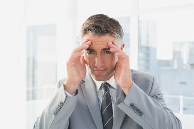 Businessman suffering from a headache