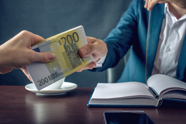 Businessman in suit receiving money