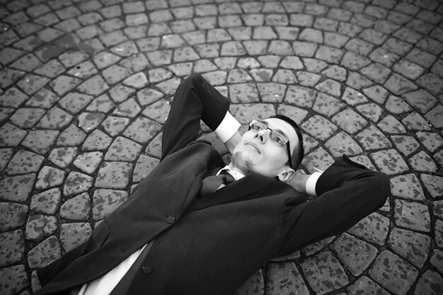 Businessman in a suit on the street black-and-white photo