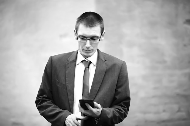 Businessman in a suit on the street black-and-white photo