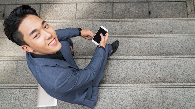 Businessman in a suit using a phone