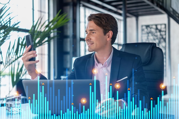 Businessman in suit using smart phone to optimize trading
strategy at corporate finance fund forex chart hologram over modern
panoramic office background