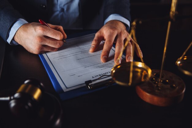 Businessman in the suit with attorney and lawyer documents isolated