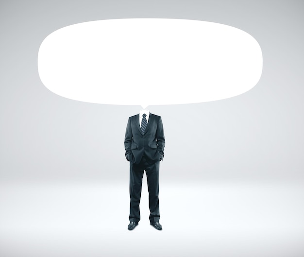 Businessman in suit with empty speech bubbles