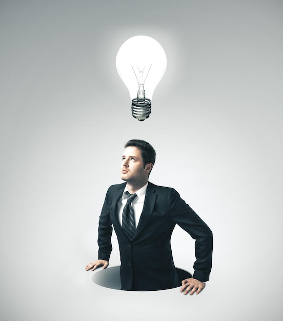 Businessman in suit with lightbulb