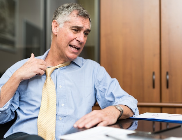 Businessman sweating in his office