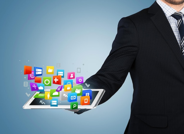 Businessman and tablet pc   on  background