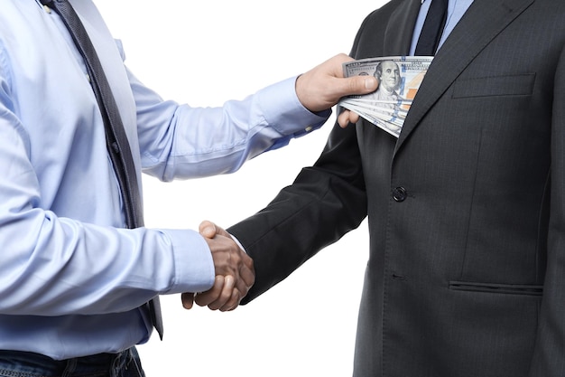 Фото Бизнесмен берет деньги у человека на белом фоне.